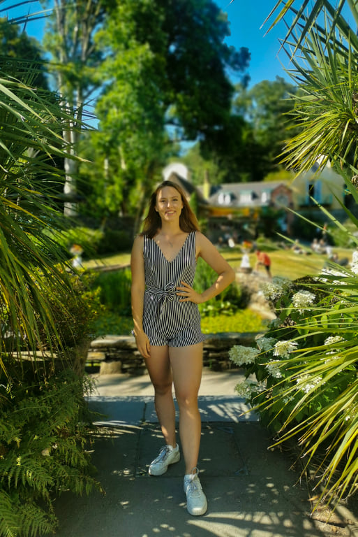 Girl stood amidst the greenery at Portmeirion in Wales, UK.
When is the best time to visit Portmeirion? Definitely not summer!